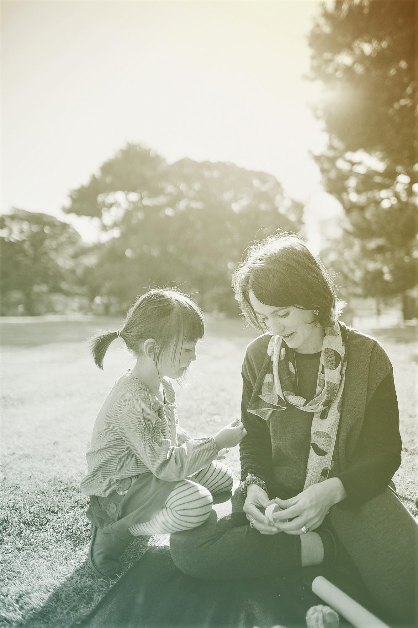 mother and daughter having a picnic