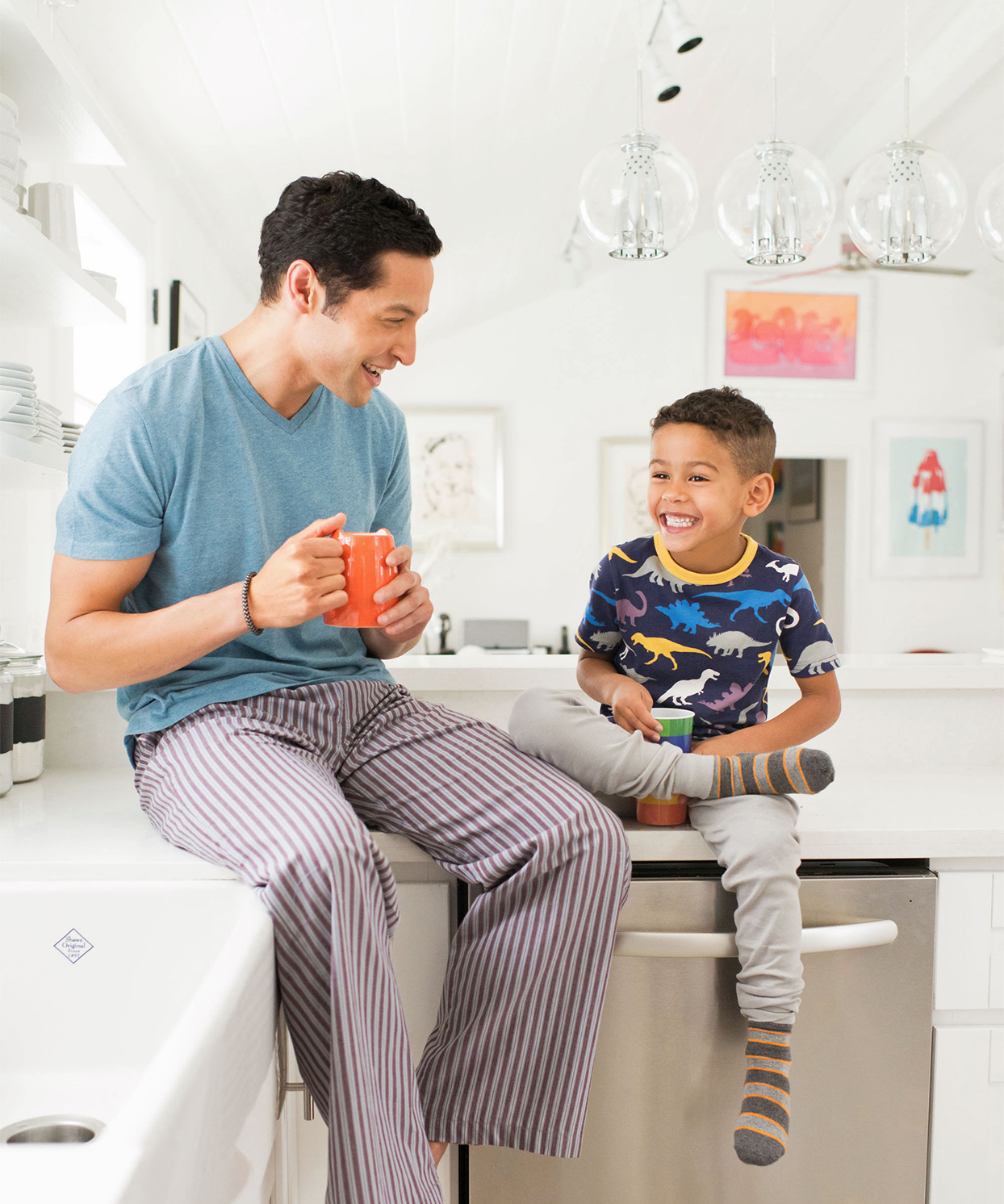 father and son talking on kitchen counter