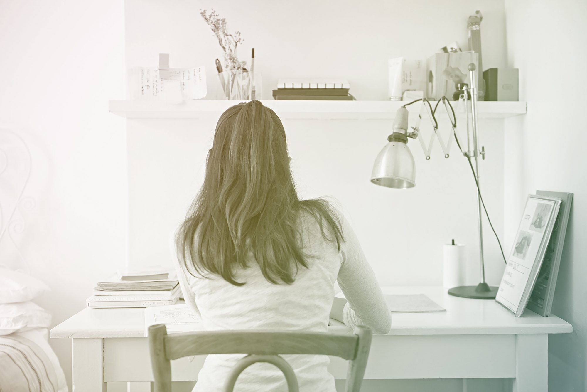 back view of student working on desk