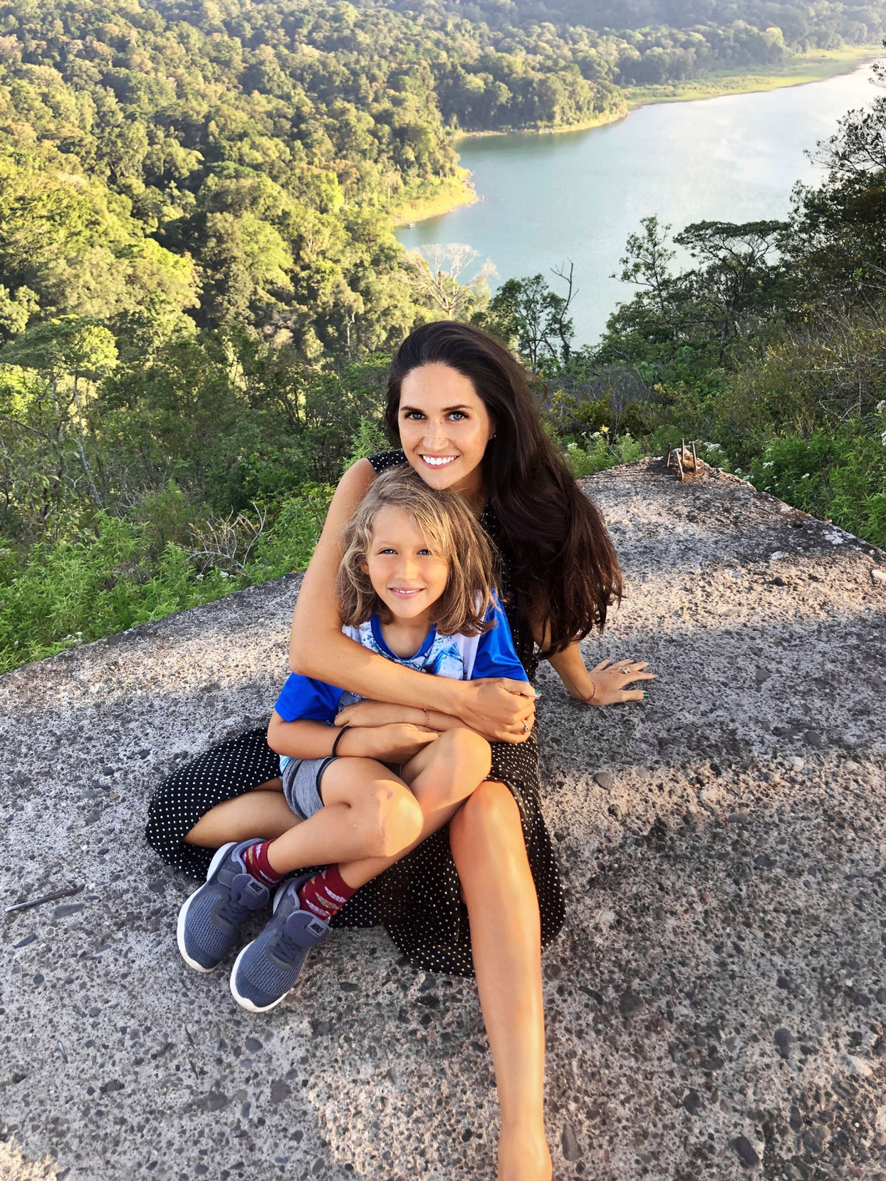 mother and son on cliff in bali