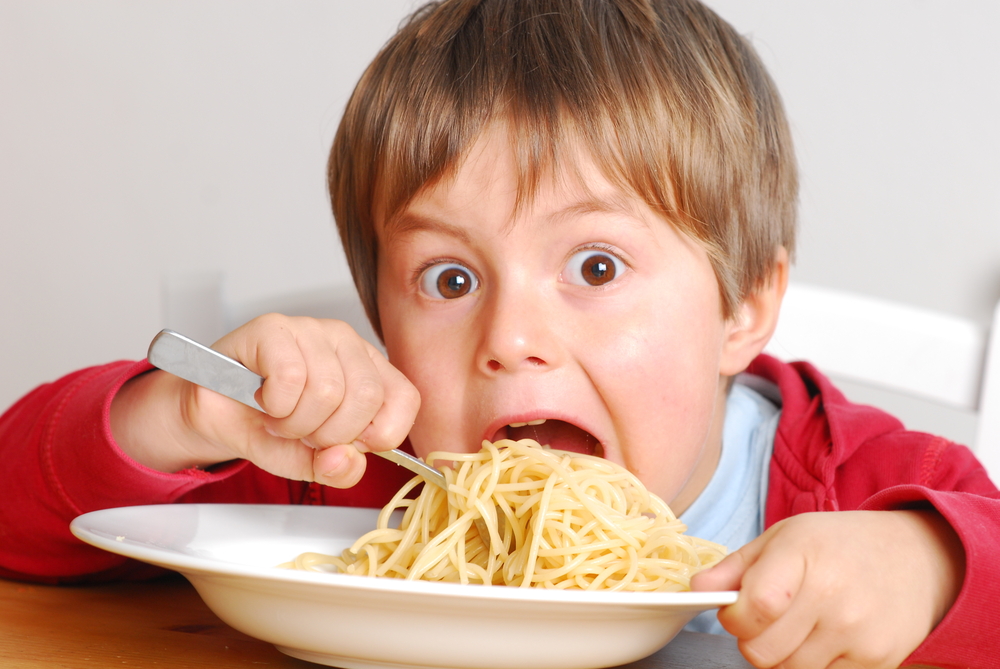 Hungry Child Eating Spaghetti