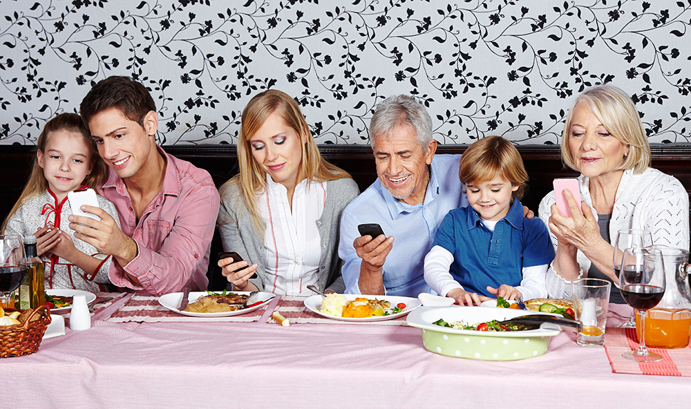 family texting at dinner