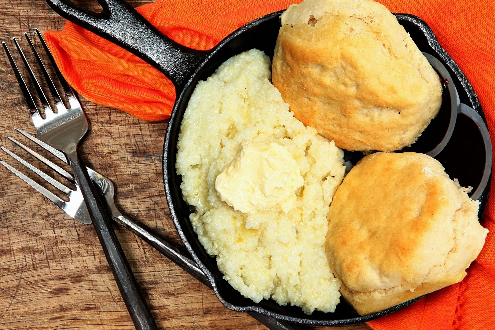 Grits and Biscuits on Iron Skillet with Metal Fork