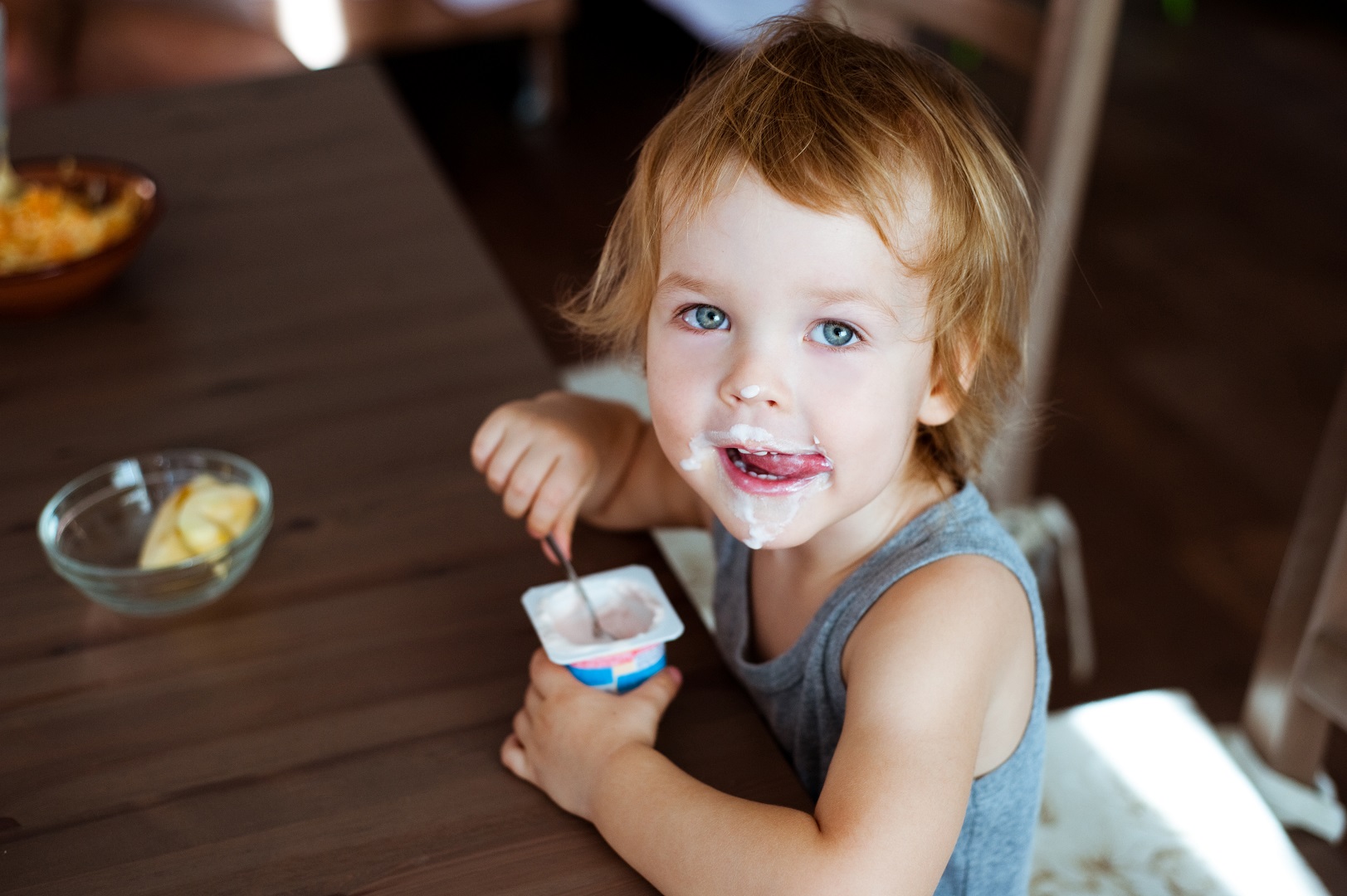 Child Eating Yogurt Messy Mouth