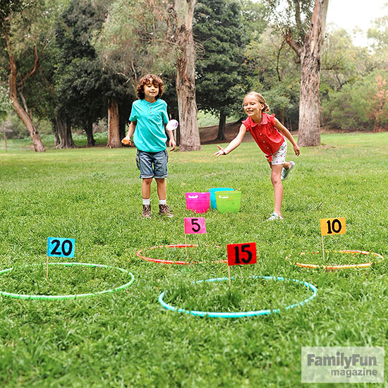 Two kids playing game on lawn