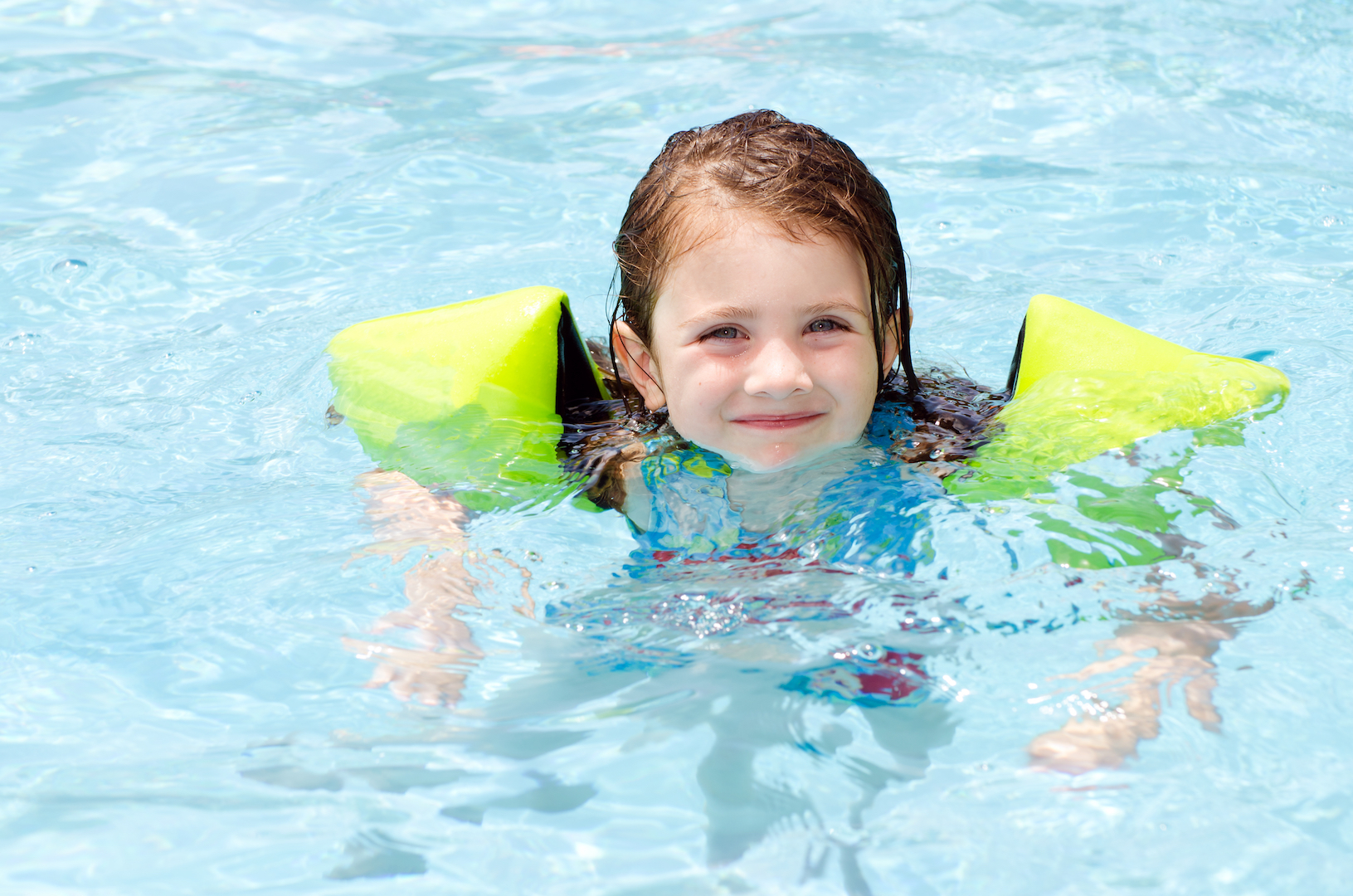 Girl Swimming with Water Wings Floaties.jpg