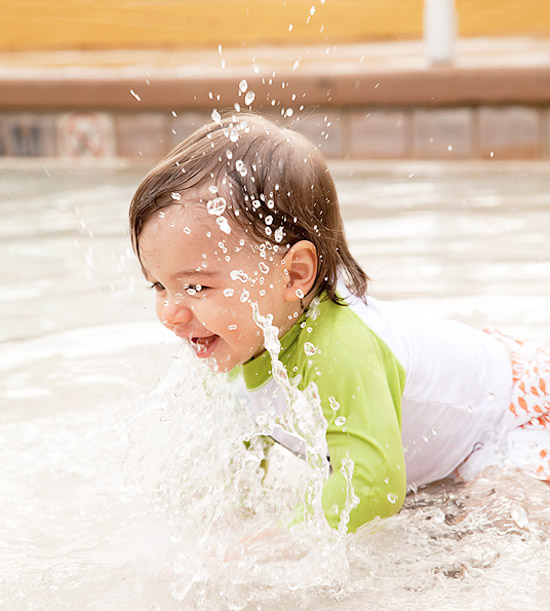 Baby splashing in water