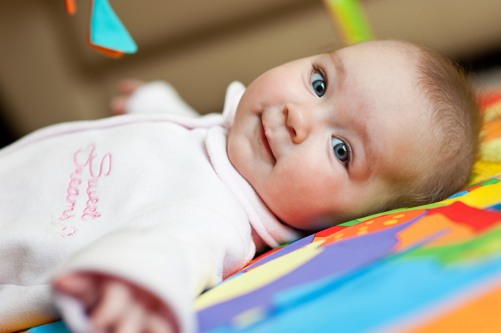 Four Baby Exercises Smiling Baby Laying On Back