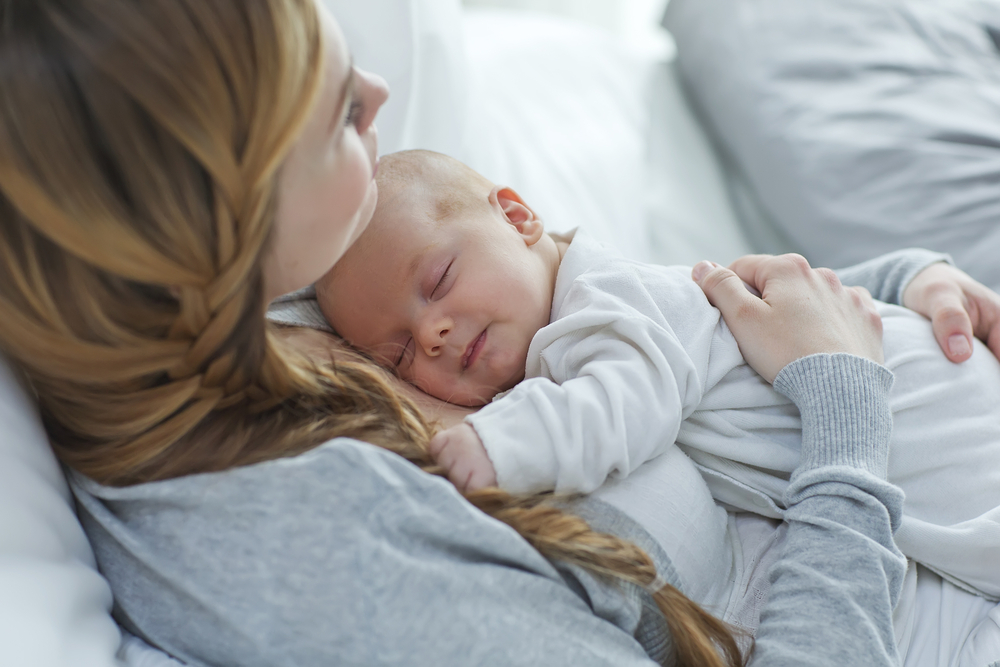 Happy mother with newborn baby