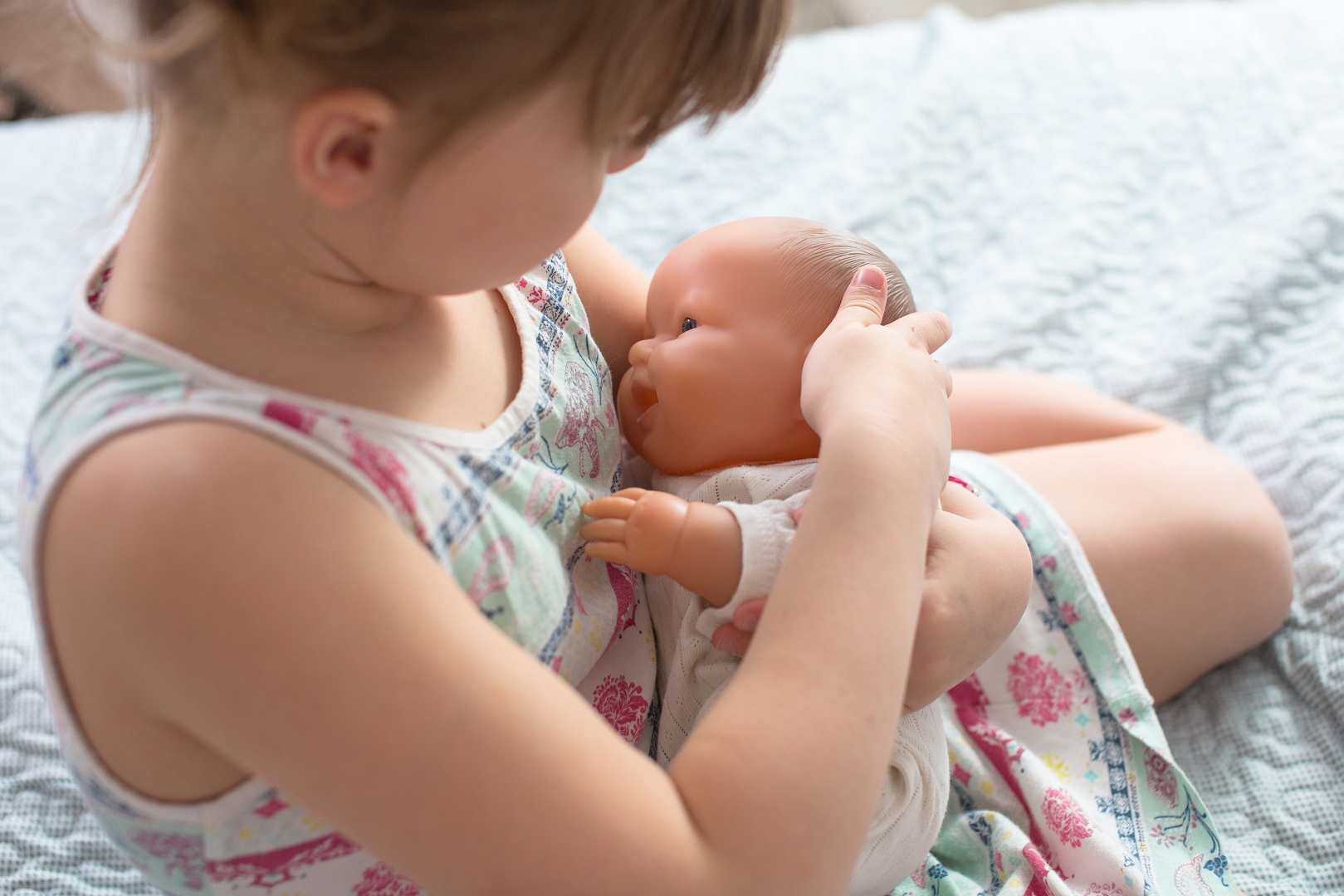 Young Girl Pretend Breastfeeding Baby Doll