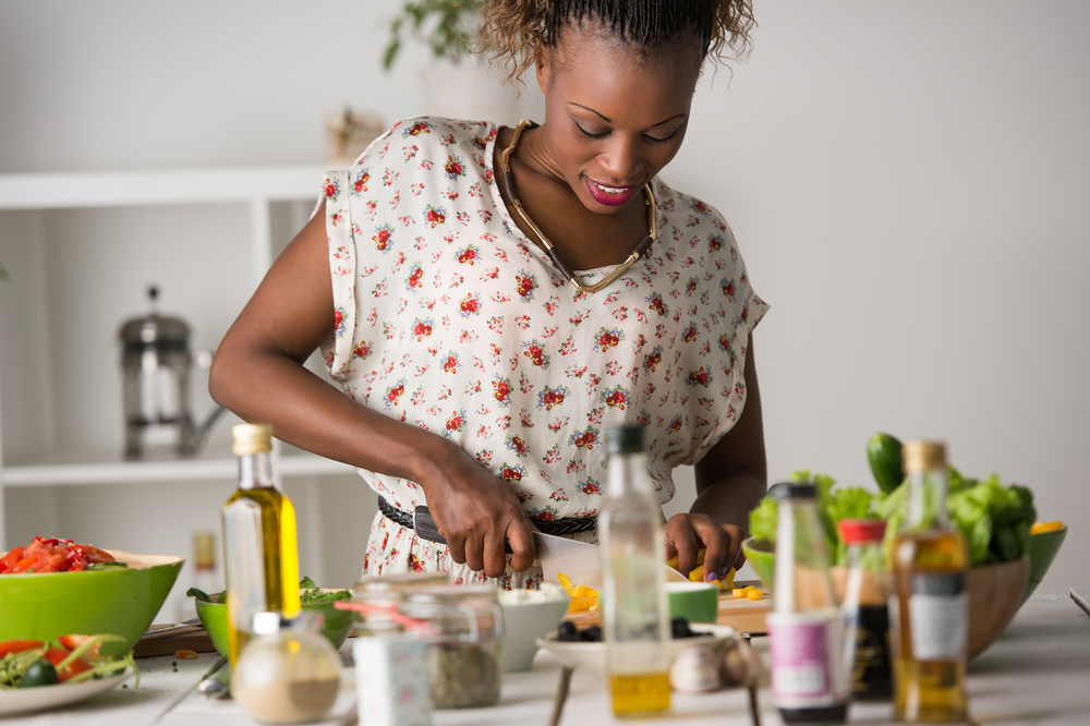 Woman in Floral Shirt Cooking